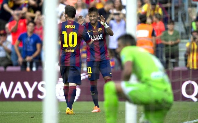 Messi y Neymar, celebrando uno de sus goles al Granada